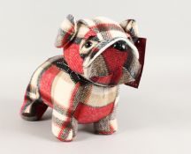 A TARTAN BULL DOG DOOR STOP.