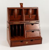 A GOOD LEATHER STATIONERY BOX opening to reveal a folding fitted interior. 18ins long x 10ins high.