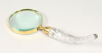 A MAGNIFYING GLASS with cut glass handle.