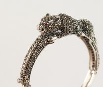 A SILVER MARCASITE PANTHER BANGLE.