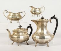 A GEORGE V SILVER FOUR-PIECE TEA SET, comprising teapot, hot water jug, sugar basin and milk jug.