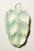 A JADE LEAF PENDANT.
