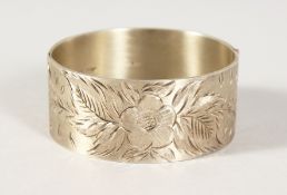 A BRIGHT CUT SILVER BANGLE.