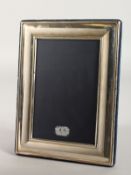 A PLAIN UPRIGHT PHOTOGRAPH FRAME. 7.5ins x 6ins.