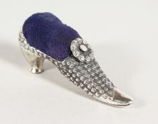 A CAST SILVER VICTORIAN SHOE PIN CUSHION.
