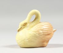 A ROYAL WORCESTER RARE BLUSH IVORY MINIATURE MODEL OF A SWAN, date code 1903.