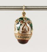 A RUSSIAN SILVER AND ENAMEL EGG PENDANT.