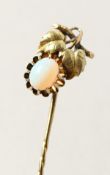 A GOLD AND OPAL STICK PIN.