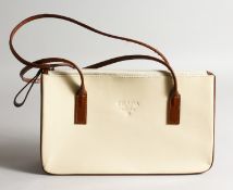 A PRADA OF MILANO CREAM BAG.