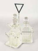 A SILVER PLATE STAND with three cut glass whisky decanters and stoppers.