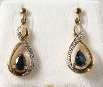 A PAIR OF 9K GOLD PEAR SHAPED SAPPHIRE AND DIAMOND DROP EARRINGS.