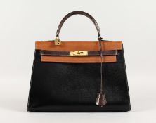 A GOOD HERMES TWO COLOUR LEATHER KELLY BAG, dark and light brown with brass lock. No. 212. 13ins