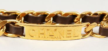 A CHANEL GILT METAL AND LEATHER BELT.