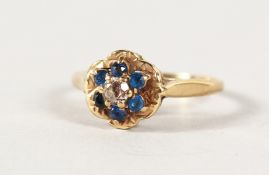 A 9CT GOLD CLUSTER RING.