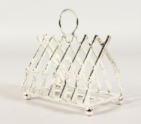 A SILVER PLATE CROSS RIFLE SIX-DIVISION TOAST RACK.