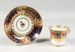 AN EARLY 19TH CENTURY CHAMBERLAIN WORCESTER CUP AND SAUCER painted in an Imari style pattern 293.