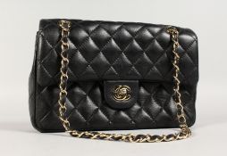 AN OFFICIAL CHANEL QUILTED LAMBSKIN MINI SQUARE FLAP BAG with GP chain and fittings.