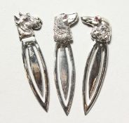 THREE SILVER BOOK MARKERS.