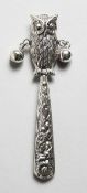 A SILVER NOVELTY OWL RATTLE.
