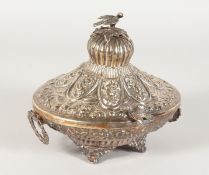A GOOD ISLAMIC SILVER OVAL BOX AND COVER with repousse decoration, handles and bird surmount. 6ins