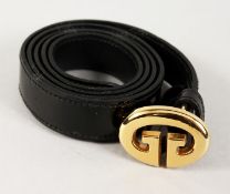 A GUCCI BLACK LEATHER BELT with gilt GUCCI.