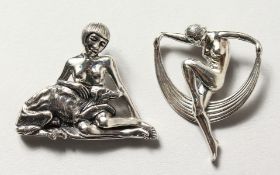 TWO SILVER ART DECO DESIGN LADY AND DOG BROOCHES.
