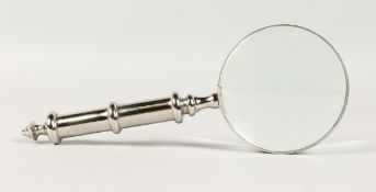 A MAGNIFYING GLASS with chrome handle.