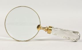 A MAGNIFYING GLASS with cut glass handle.