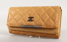 A GOOD CHANEL LEATHER PADDED PURSE. 7.5ins long, in a Chanel bag.