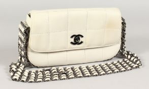 A VERY GOOD CHANEL LIMITED EDITION PADDED WHITE LEATHER BAG. 9ins wide, with five-row metal and