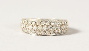 A 9CT GOLD TRIPLE ROW DIAMOND RING.