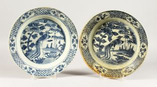 TWO CHINESE WANLI PERIOD BLUE AND WHITE PEACOCK DESIGN PLATES. 11ins diameter.