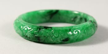 A CARVED JADE BANGLE.