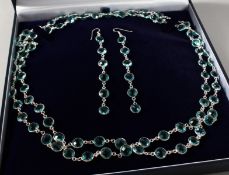 A SILVER BLUE TOPAZ LONGUARD CHAIN AND EARRING SET.