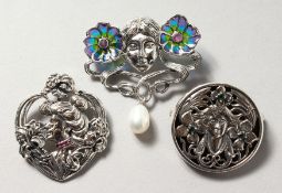 THREE SILVER ART NOUVEAU DESIGN BROOCHES.