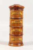 A FOUR-TIER WOOD SPICE TOWER, Cloves, Ginger, Mace and Nutmeg. 7.5ins high.