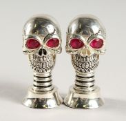 A PAIR OF .925 SILVER PLATE SKULL SALT AND PEPPER.
