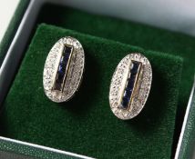 A PAIR OF 9CT GOLD SAPPHIRE AND DIAMOND DECO DESIGN EARRINGS.