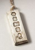 A SILVER HALLMARK PENDANT AND CHAIN.