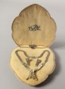 A 1950'S SILVER PASTE NECKLACE AND EARRINGS.