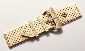 A LONG 9CT GOLD BRACELET with buckle.