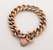 A 9CT GOLD LINK BRACELET with padlock.