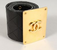 A 3-INCH WIDE PADDED BLACK CHANEL BELT with gilt CC.