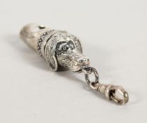 A SILVER DOG WHISTLE.