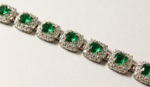 A GOOD SILVER AND GREEN STONE LINE BRACELET.