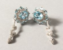 A PAIR OF SILVER BLUE TOPAZ SNAKE EARRINGS.