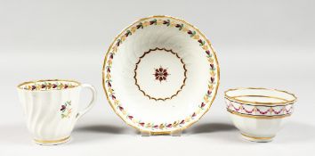 A LATE 18TH CENTURY NEW HALL TYPE FACETED COFFEE CUP, TEA BOWL AND SAUCER painted with puce festoons
