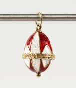 A RUSSIAN SILVER AND ENAMEL EGG PENDANT.