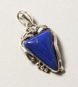 A SILVER AND LAPIS PENDANT.