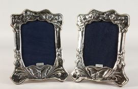 A PAIR OF SILVER PHOTOGRAPH FRAMES. 8ins x 6ins.